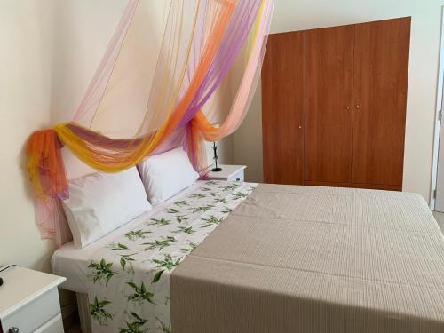 a bedroom with a bed with a canopy at Casa Claudia - Pool and Wifi in Silves