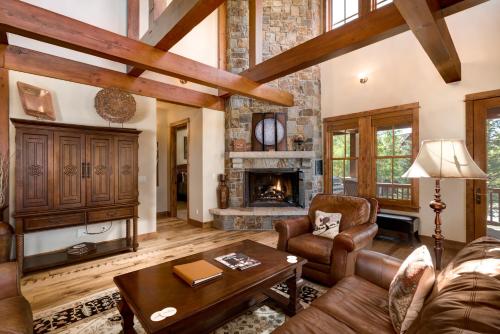 a living room with a couch and a fireplace at The Porches in Steamboat Springs
