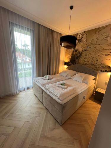 Кровать или кровати в номере Niechorze - Par La Mer 6B