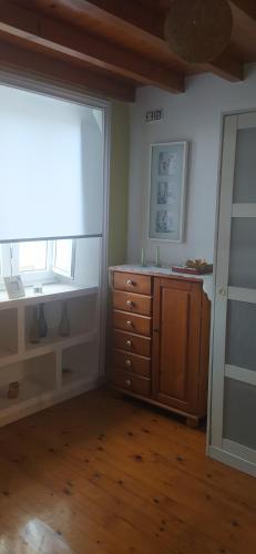 a room with a dresser and a window in a room at Villa ELSA 27286AAXS8 TU986D RITGA-E-2023-05277 in Foz