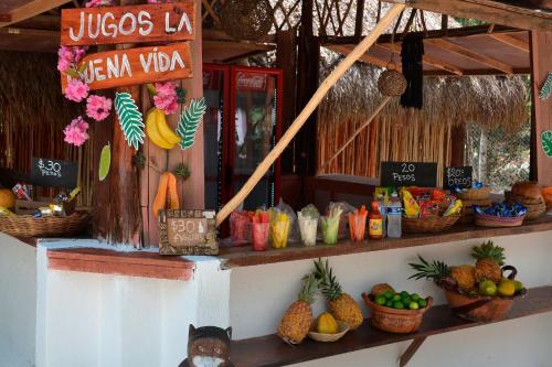 a fruit stand with fruits and vegetables on display at Kakao Cobá Hotel & Cenote Experience in Cobá