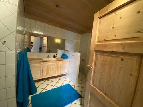 a bathroom with a sink and a mirror at La Casa Nostra in Asker, only 17 minutes to Oslo in Asker