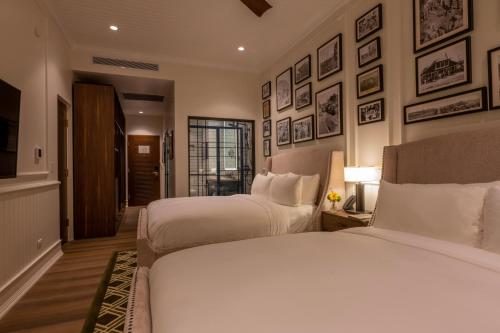 Cama o camas de una habitación en Hotel La Compañía Casco Antiguo