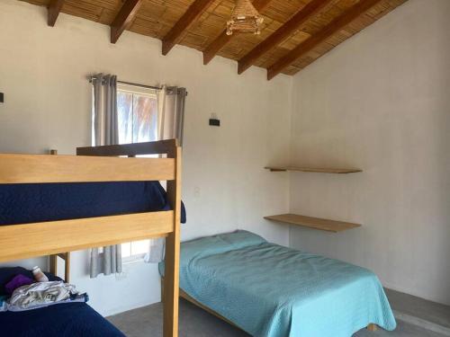 Postel nebo postele na pokoji v ubytování MIAZ Casa de Playa en Canoas de Punta Sal