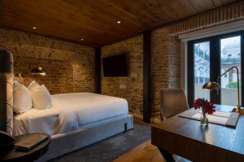 Cama o camas de una habitación en Hotel La Compañía Casco Antiguo