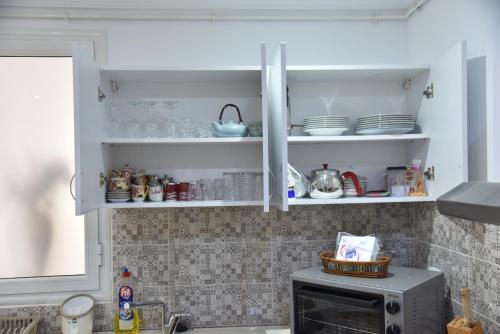 Appartements neufs et modernes entre ter et merにあるキッチンまたは簡易キッチン