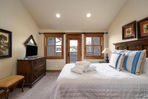 a bedroom with a bed with two pillows on it at The Porches in Steamboat Springs