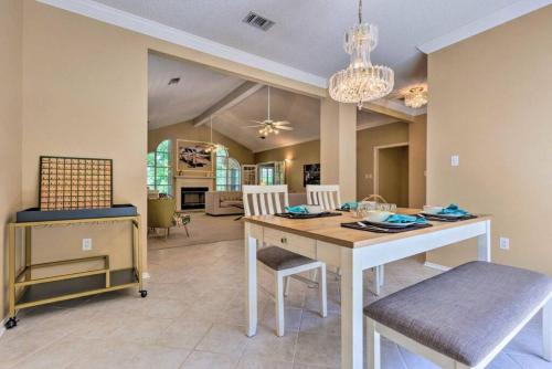 a dining room and living room with a table and chairs at 16th and Golden in Diamondhead in Diamondhead