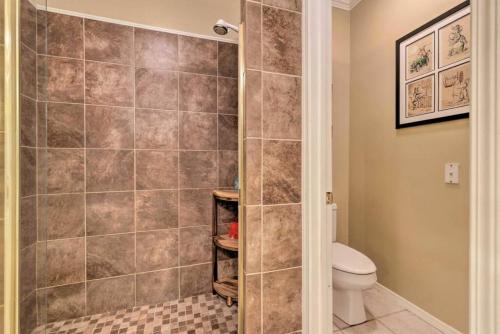 a bathroom with a shower with a toilet at 16th and Golden in Diamondhead in Diamondhead