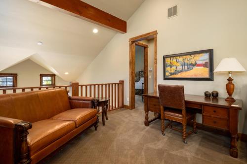 a living room with a couch and a desk at The Porches in Steamboat Springs