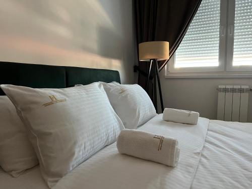 Postel nebo postele na pokoji v ubytování Apartman Lux harmonija