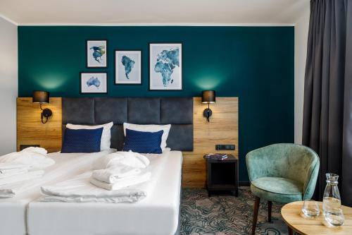 Postel nebo postele na pokoji v ubytování Hotel Kyriad Stargard