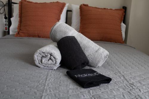 a stuffed animal on top of a bed at POSIDONIA RESORT No7 in Nea Vrasna