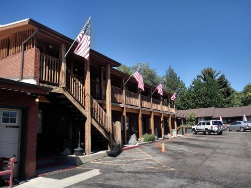 a row of flags on the front of a building at The Charin Inn in Clearfield