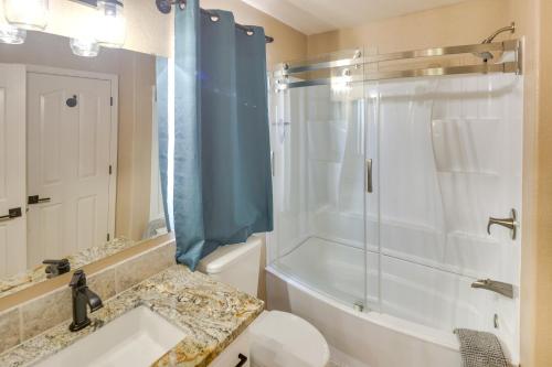 a bathroom with a shower and a sink and a toilet at Lovely Bullhead City Retreat with Patio and Grill! in Bullhead City