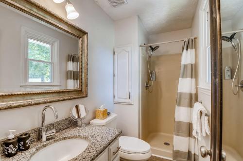 a bathroom with a sink and a toilet and a mirror at 3BR 2BATH Gorgeous Country Near Nashville F1 in Franklin