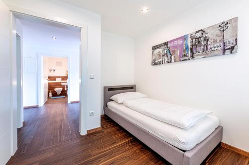 מיטה או מיטות בחדר ב-Traunstein Apartment Aleksandra