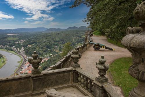 a bike is parked on the side of a stone ledge at Altstadt Domizil in Pirna