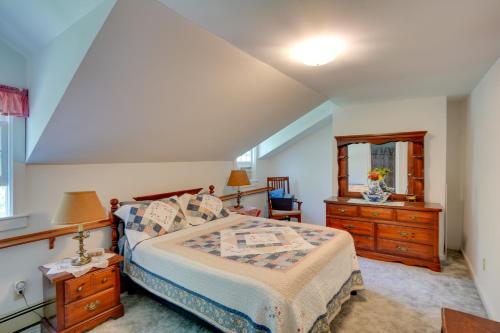 a bedroom with a bed and two dressers and a window at Waterfalls and Trails at The Mills At Green Hole in Hillsdale