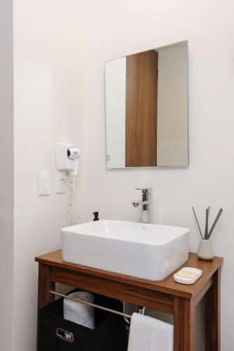 a bathroom with a white sink and a mirror at Majestic 1BR with Balcony in Cuauhtémoc in Mexico City