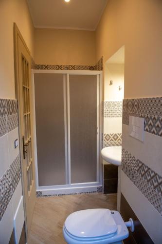 a bathroom with a toilet and a sink at I Milord 2 in Castel San Giorgio