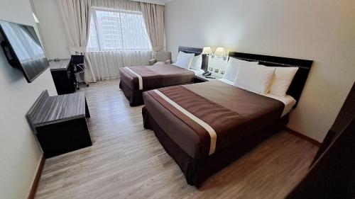 Katil atau katil-katil dalam bilik di Hotel Diego de Almagro Providencia