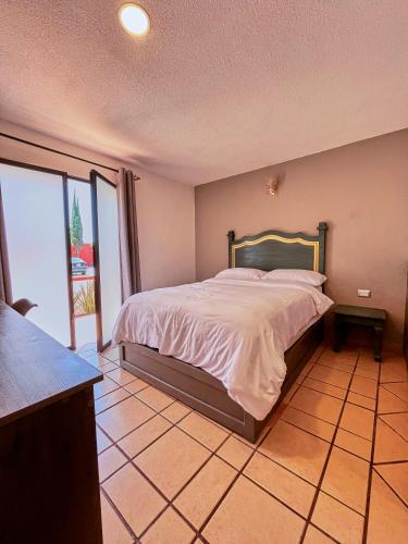 Postel nebo postele na pokoji v ubytování Hotel Casa Real Cholula