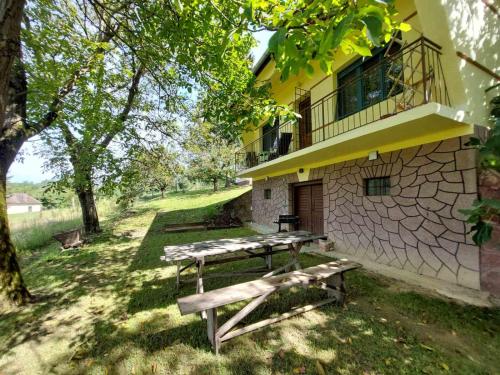 a picnic table in front of a building at Marókahegy in Zalakaros