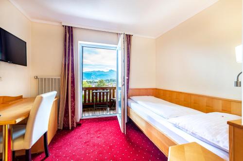 Un ou plusieurs lits dans un hébergement de l'établissement Panorama Hotel Traunstein