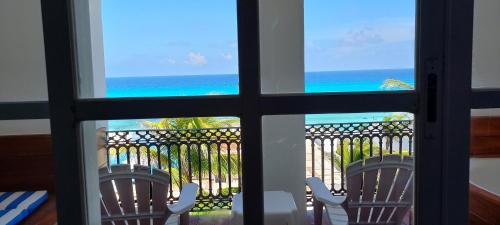 a view of the ocean from a window at Hotel & Museo Casa Turquesa in Cancún