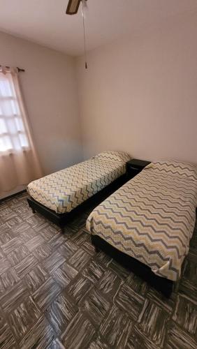 Una cama o camas en una habitación de Dúplex ciudad de Mendoza - 5 personas - Doble estacionamiento