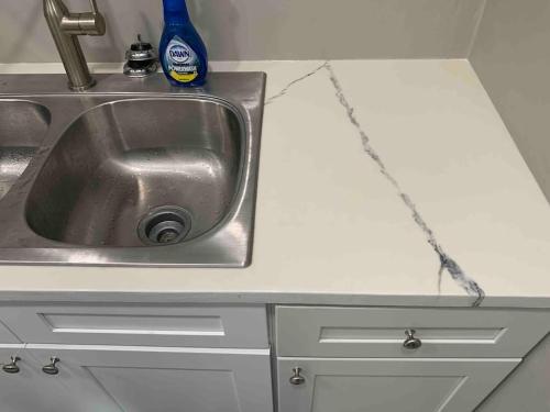 a kitchen counter with a sink with a chain around it at Apartment in Daytona Beach 1BR 1Bath Centrally Located in Daytona Beach