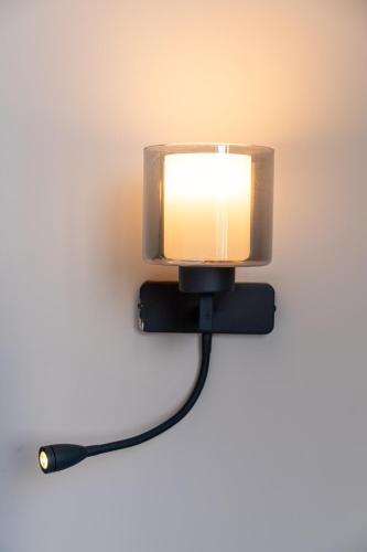 a tv on a wall with a cord plugged into it at Han Residence Haliç in Istanbul