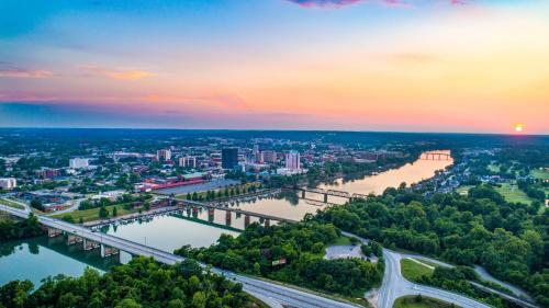 an aerial view of a city with a bridge over a river at Holiday Inn Express & Suites Lexington by IHG in Lexington