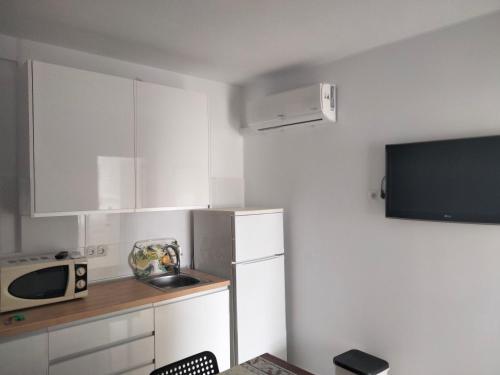 Køkken eller tekøkken på Apartamentos Playa Holidays