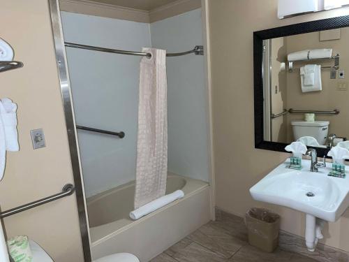 a bathroom with a shower and a sink and a toilet at Best Western Bennington in Bennington