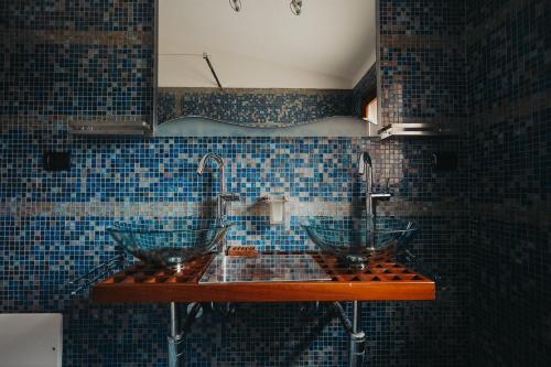 a bathroom with two sinks and two faucets at Villa Alba Sul Mare in Budoni