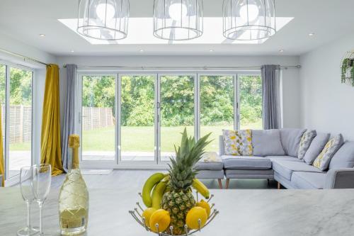 a bowl of fruit on a table in a living room at The Orchard - Spacious 5 Bed in Burton upon Trent