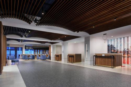 a lobby with desks and chairs in a building at Courtyard by Marriott Orlando Lake Buena Vista at Vista Centre in Orlando