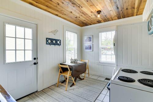 a kitchen with a table and a stove at Charming Abode about 2 Mi to Mississippi State Campus! in Starkville