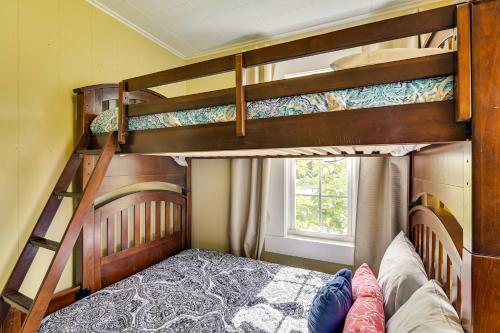 two bunk beds in a room with a bed at Charming Abode about 2 Mi to Mississippi State Campus! in Starkville