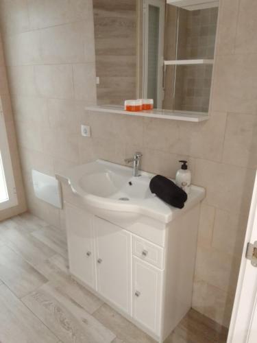 a bathroom with a white sink and a mirror at Blanco y Tinto in Logroño