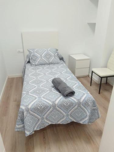 a bed with a pillow on it in a bedroom at Blanco y Tinto in Logroño