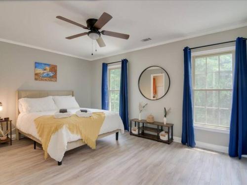 a bedroom with a bed and a ceiling fan at Beacon House, Central to Augusta in Augusta