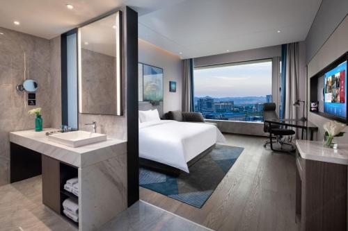 Hampton By Hilton Hangzhou Future Sign Technology Cityにあるベッド