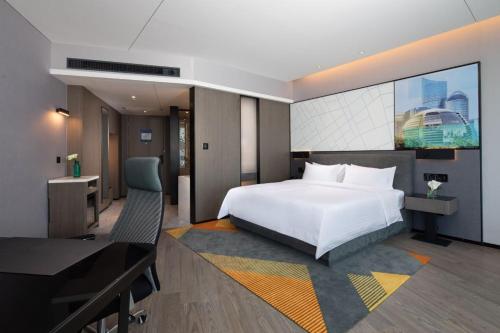 Postel nebo postele na pokoji v ubytování Hampton By Hilton Hangzhou Future Sign Technology City