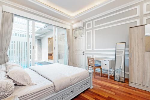 Postel nebo postele na pokoji v ubytování Desa Residence