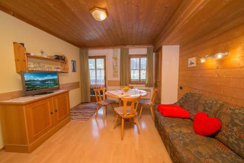 a living room with a couch and a table at Apartments Kitzsteinhorn in Zell am See