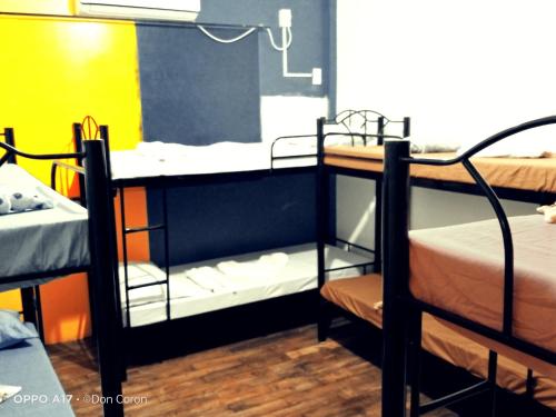 a group of bunk beds in a room at Footprints Hostel in Coron