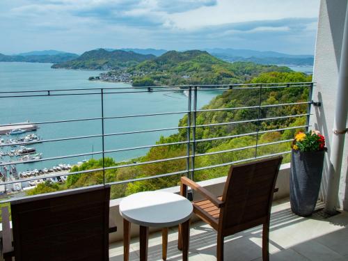 a balcony with a view of the water at Bella Vista Spa and Marina ONOMICHI in Onomichi